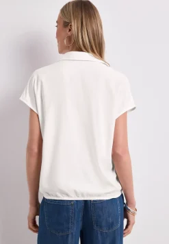 Blouse à col chemise et ourlet élastiqué