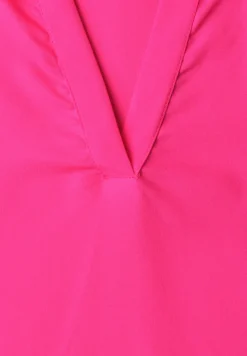 Blouse à col chemise et ourlet élastiqué
