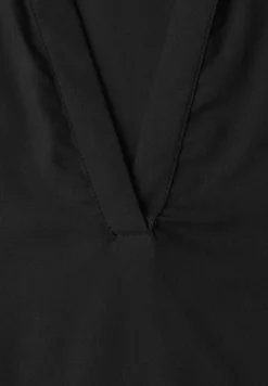 Blouse à col chemise et ourlet élastiqué