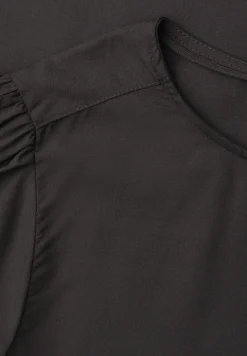 Blouse à col rond et manches courtes bouffantes