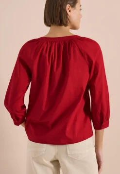Blouse à manches 3/4 avec col fendu en couleur unie
