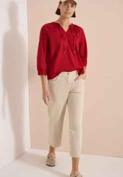 Blouse à manches 3/4 avec col fendu en couleur unie