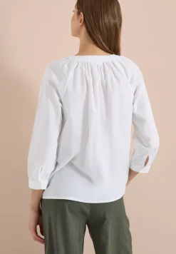Blouse à manches 3/4 avec col fendu en couleur unie