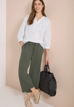 Blouse à manches 3/4 avec col fendu en couleur unie