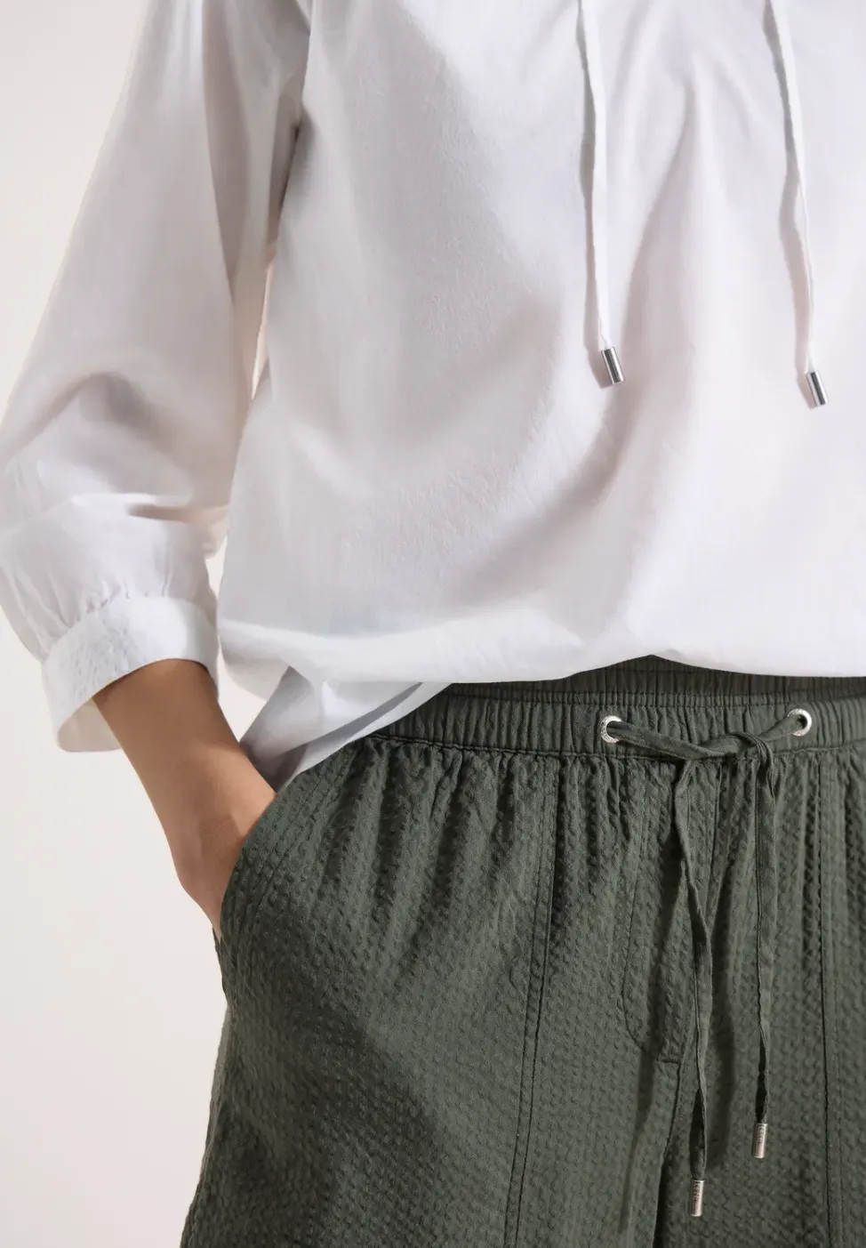 Blouse à manches 3/4 avec col fendu en couleur unie