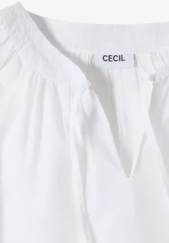 Blouse à manches 3/4 avec col fendu en couleur unie
