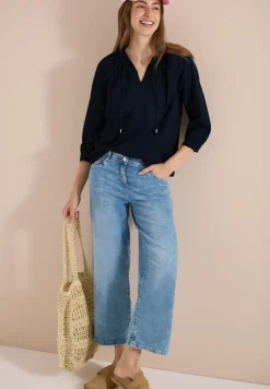 Blouse à manches 3/4 avec col fendu en couleur unie