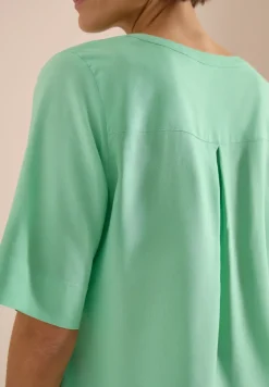 Blouse à manches courtes avec col fendu