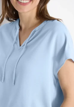 Blouse à manches courtes avec mélange de structures