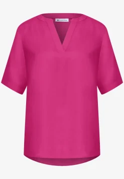 Blouse à manches courtes avec col fendu en couleur unie