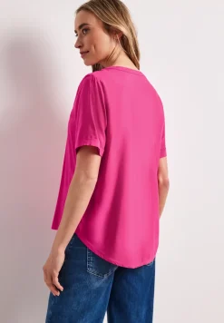Blouse à manches courtes avec col fendu en couleur unie