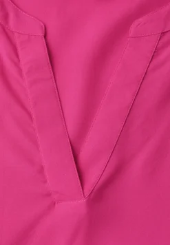 Blouse à manches courtes avec col fendu en couleur unie