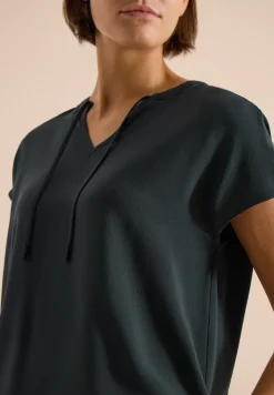 Blouse à manches courtes avec mélange de structures