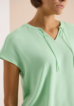 Blouse à manches courtes avec mélange de structures