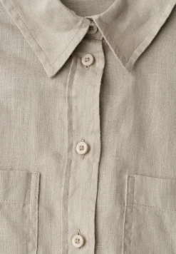 Blouse à manches longues avec poches sur la poitrine