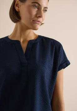 Blouse à épaules tombantes en seersucker