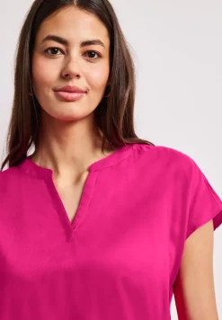 Blouse à épaules tombantes avec col fendu