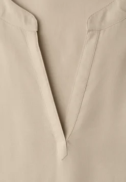 Blouse à épaules tombantes avec col fendu