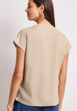Blouse à épaules tombantes avec col fendu