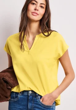 Blouse à épaules tombantes avec col fendu