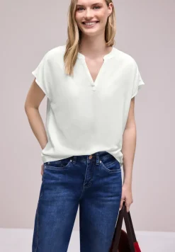 Blouse à épaules tombantes avec col fendu