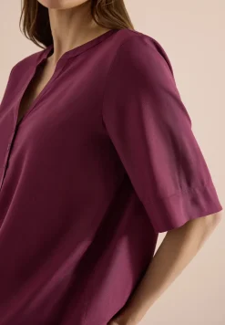 Blouse avec col fendu et ourlet élastique