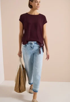 Blouse avec col rond et détail de nœuds