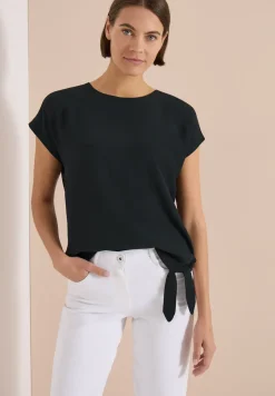 Blouse avec col rond et détail de nœuds