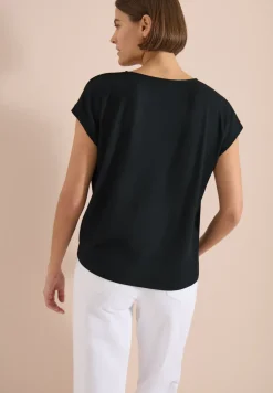 Blouse avec col rond et détail de nœuds