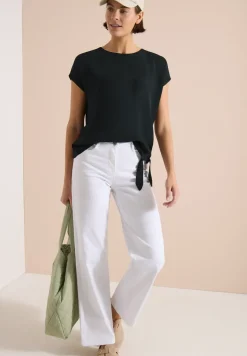 Blouse avec col rond et détail de nœuds