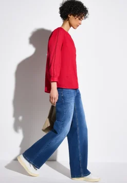 Blouse avec détails en tape