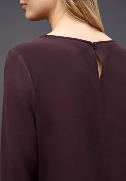 Blouse avec poignets smockés