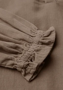 Blouse en velours côtelé avec détails à volants