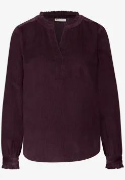 Blouse en velours côtelé avec volants