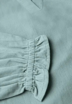 Blouse en velours côtelé avec détails à volants