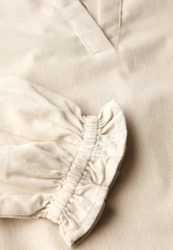 Blouse en velours côtelé avec détails à volants