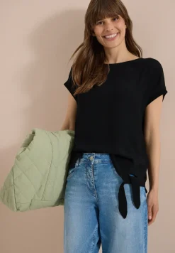 Blouse avec col rond et détail de nœuds