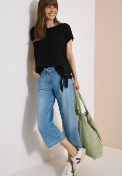 Blouse avec col rond et détail de nœuds