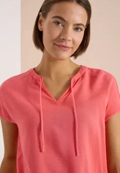 Blouse à manches courtes avec mélange de structures