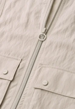 Gilet zippé avec cordon de serrage