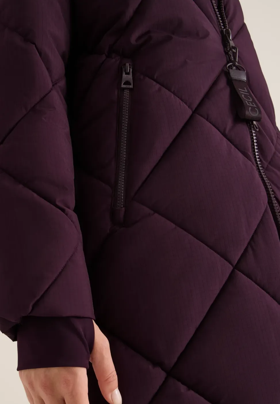 Manteau avec sac à dos Strings