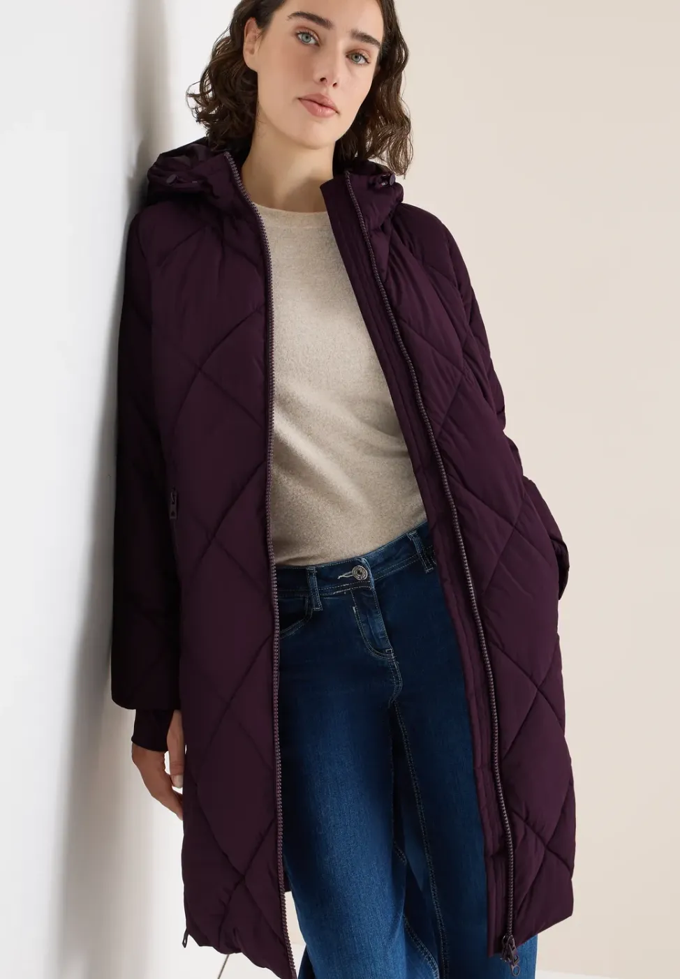 Manteau avec sac à dos Strings