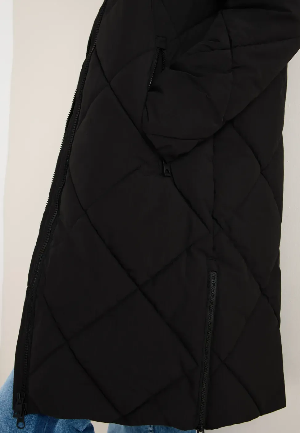 Manteau avec sac à dos Strings