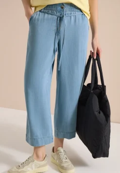 Pantalon taille haute à jambes larges, look délavé