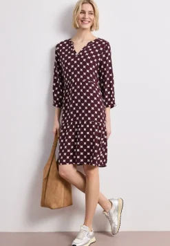 Robe à longueur de genou avec col fendu et imprimé