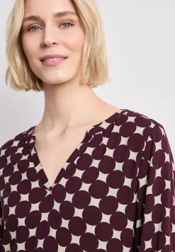 Robe à longueur de genou avec col fendu et imprimé