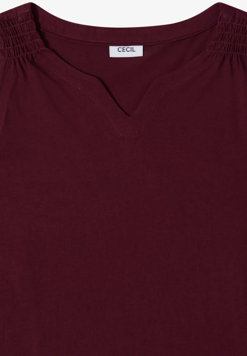 Top en couleur unie à encolure fendue