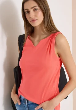 Top en couleur unie à encolure fendue