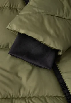 Veste à structure mixte